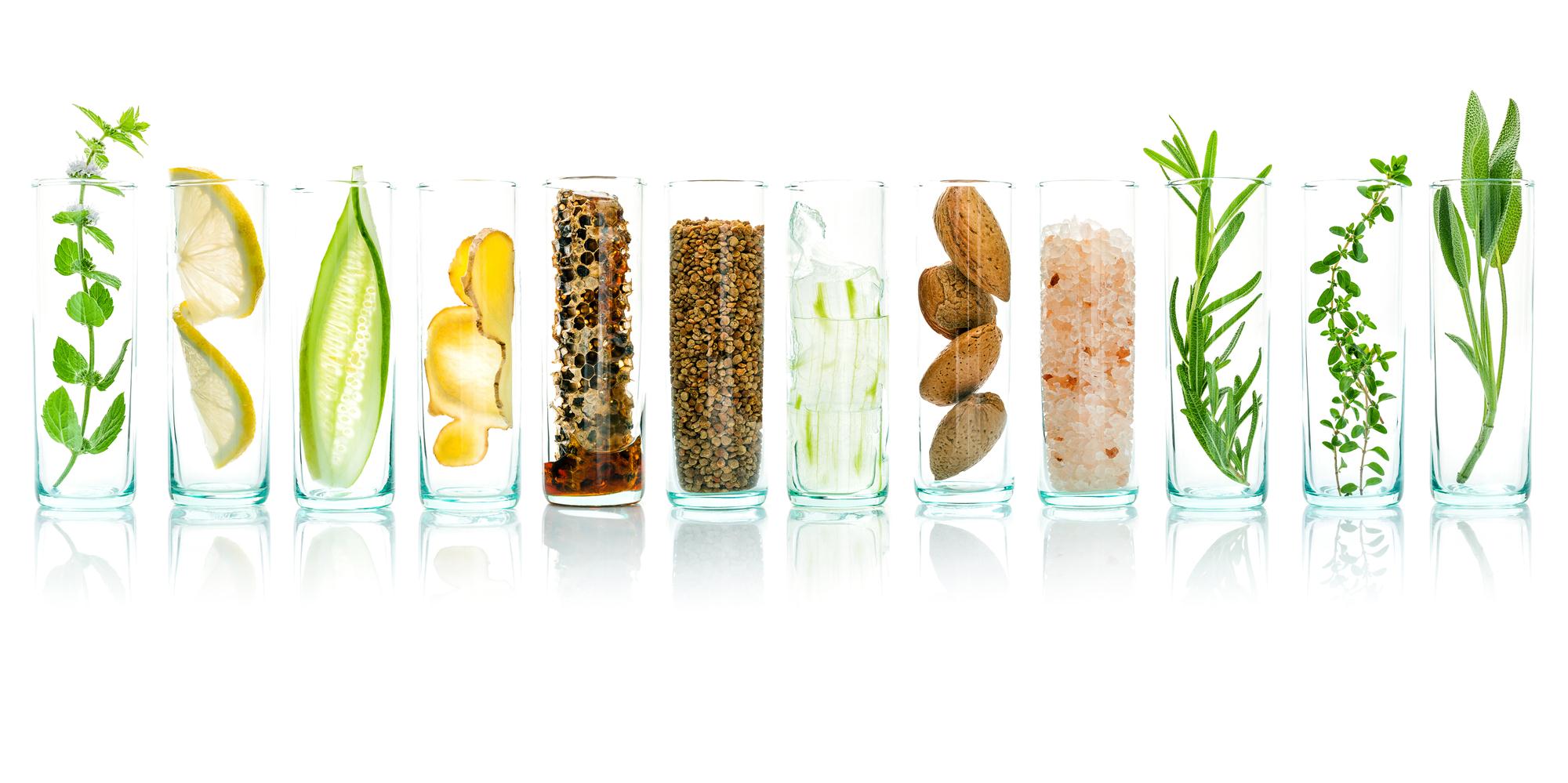 Eat your way to glowing skin. Clear glasses of water with healthy nutrients that help keep the skin healthy.