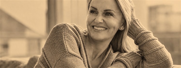 Smiling woman resting her hand behind her head